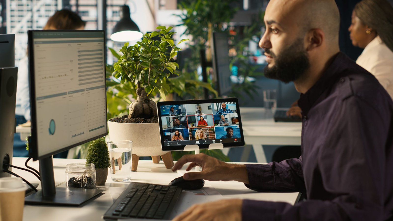 worker in office talking with colleagues during internet videocall